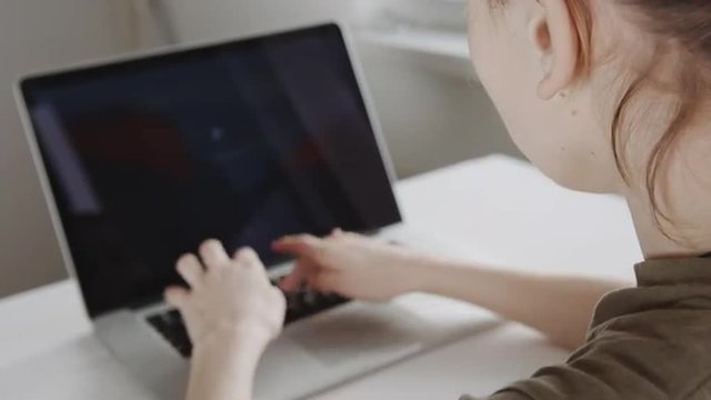 Businesswoman hands working on laptop computer 