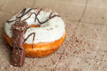Donut with jam watered white chocolate. Dark chocolate, milk cho