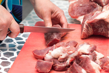 cutting meat with a knife