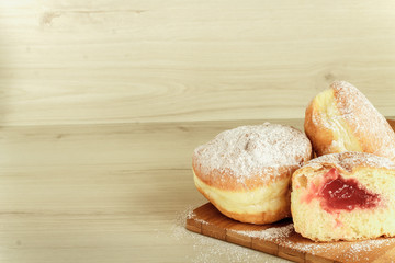 Donuts on wooden background
