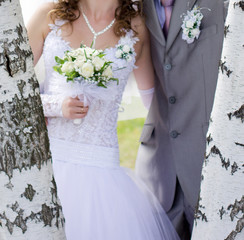 Happy bride and groom at wedding walk in park