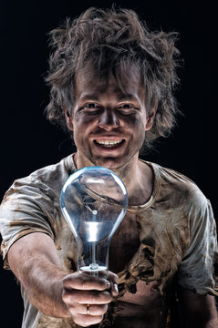 Portrait of funny  electrician with lightbulb