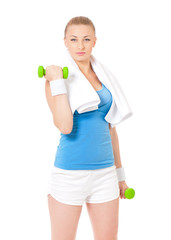 Naklejka premium Young woman in fitness wear exercising with dumbbells