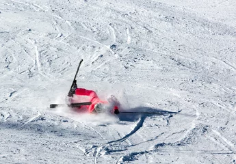 Keuken spatwand met foto Woman riding on skis fall down © hbilgen