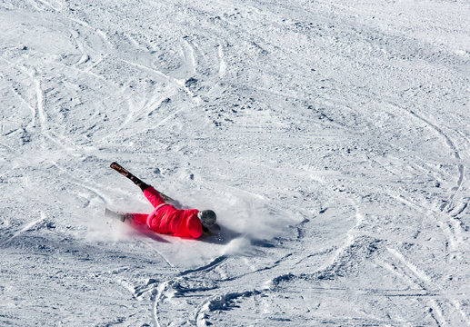 Woman Riding On Skis Fall Down