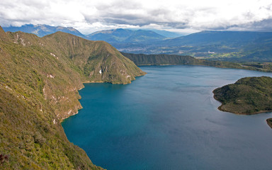 Portion of the Cuicocha lake with its surrounding crater and mountains.