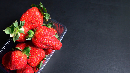Strawberries on black background