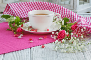 Cup of tea and roses