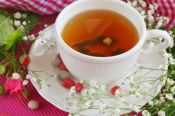 Cup of tea and roses