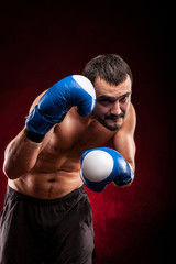 Fototapeta na wymiar Boxing man ready to fight. Boxing, workout, muscle, strength, power 