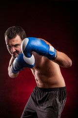 Fototapeta na wymiar Boxing man ready to fight. Boxing, workout, muscle, strength, power 