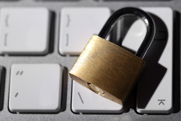 Cyber safety concept - lock on computer keyboard