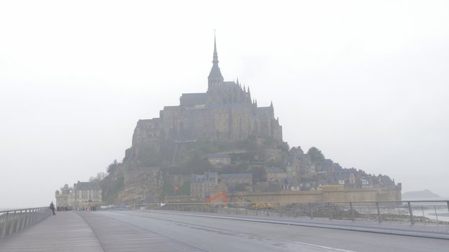 Famous Mont St Michel   tourist attraction in northern France region of Normandy  4K 2160p UltraHD footage - Mont Saint-Michel  historic symbol of French cultural  heritage 4K 3840X2160 UHD video