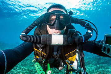 SCUBA diver on a closed circuit rebreather system