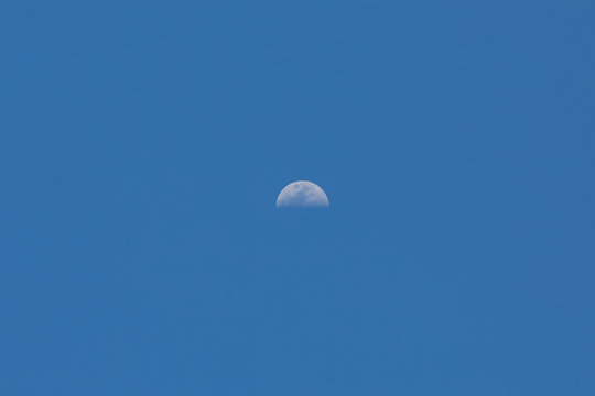 The moon in blue sky on a day