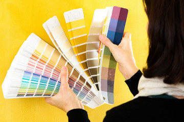 woman choosing color painting using a palette