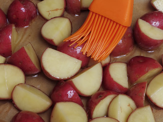 Preparing Cut Potatoes for Roasting with Olive Oil