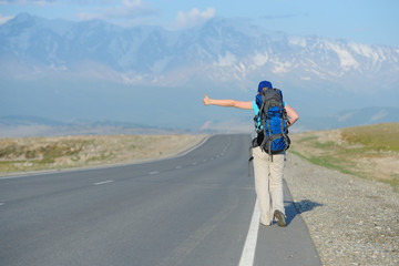 Tourist is trying to stop the car.