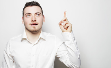 Fototapeta premium business man pointing up finger
