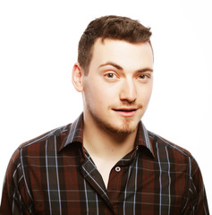 Obraz premium Handsome young man in shirt looking at camera 