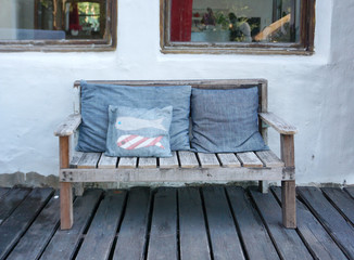 old timber bench with cushion