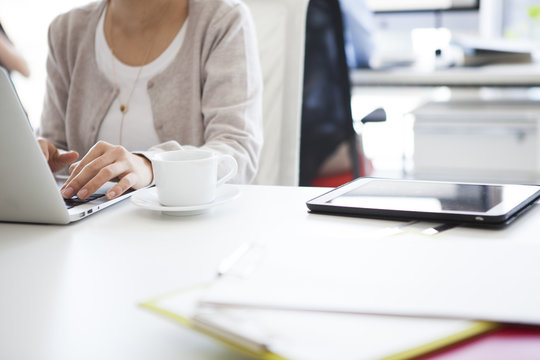 Women are at work with a laptop in the office