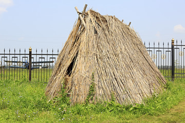 Hut made of straw. Tourist Complex Siberian Podvorye.