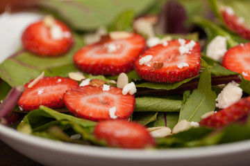Closeup of a healthy salad with strawberries