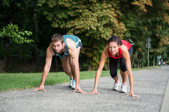 Rivalry - young couple competing in running
