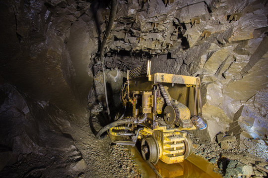 Ore loading machine in underground gold mine shaft