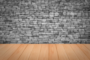 Empty top wooden table and natural stone wall background. For pr