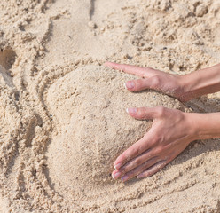 heart shaped sand pile