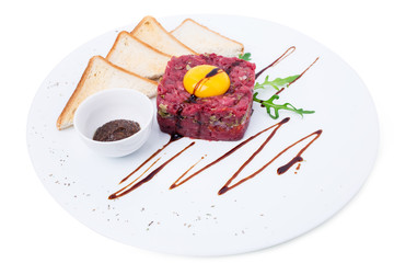 Delicious steak tartare with egg yolk.