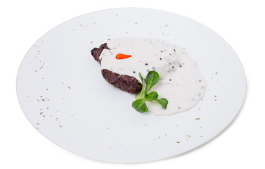 Beef steak covered with mushroom sauce.