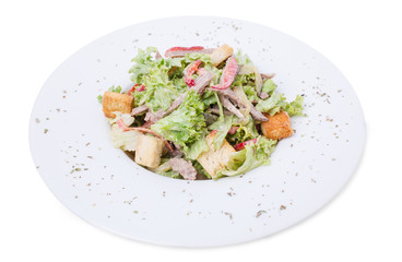 Warm beef salad with croutons.