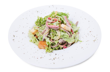 Warm beef salad with croutons.