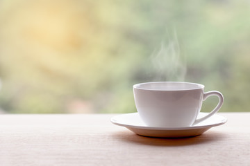 Hot americano, Black coffee in white cup on wooden table.