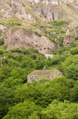 Fototapeta na wymiar Mountain scenery in Armenia. Ancient cave city in the rock. 