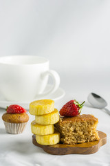 Delicious banana cake decorated with strawberry, berry sweet.