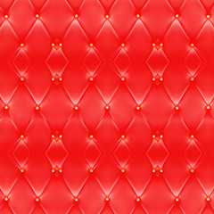 Texture of beautiful red leather sofa with golden buttons use for background.