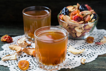 Compote of dried fruits in the jars and assorted dried fruits in