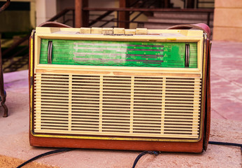 antique radio on vintage stone grunge background, retro old phot