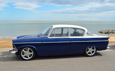 Fototapeta na wymiar Classic Blue and White Humber Sceptre on Felixstowe seafront in vintage car rally.