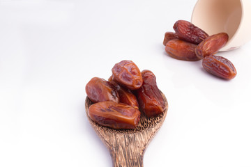 Dried dates fruit on white background