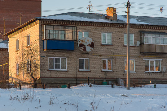 Two storey old brick house winter day