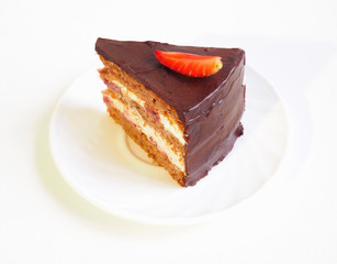 Layered chocolate cake with strawberry slice