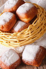 Delicious donuts beignets macro to the basket. vertical
