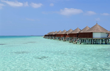 Beautiful overwater bungalows in a sunny day, Maldives