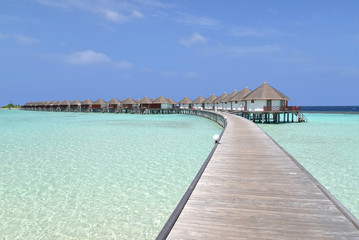 Beautiful overwater bungalows in a sunny day, Maldives