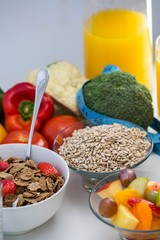 View of bowl of cereals, fruit salad and food